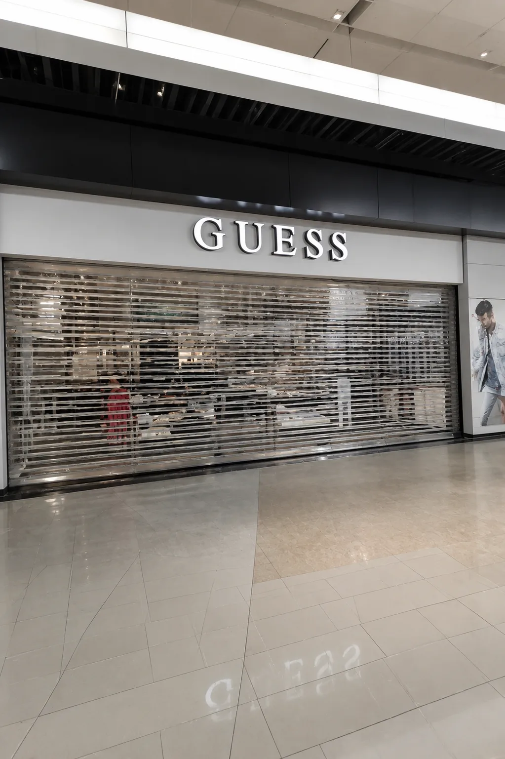 Transparent crystal roller shutter on a shopping-mall storefront