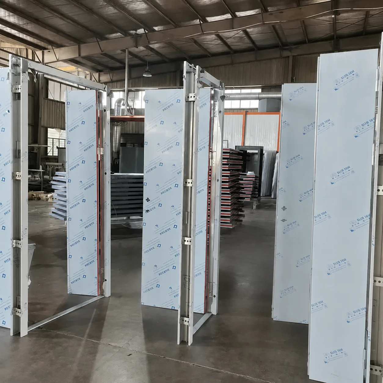 Fire door manufacturing workshop showing semi-finished units under quality control